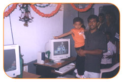 Mr. N Bitra Receiving A memento from Pinnamaneni Venkateswara Rao, Minister Technical Education, on the occasion of 56th Independence Day (15th August 2003). Bitra Net Pvt. Ltd., has donated two letest configuration computers to a School located in Puttagunta (Krishna Dist, Andhra Pradesh)